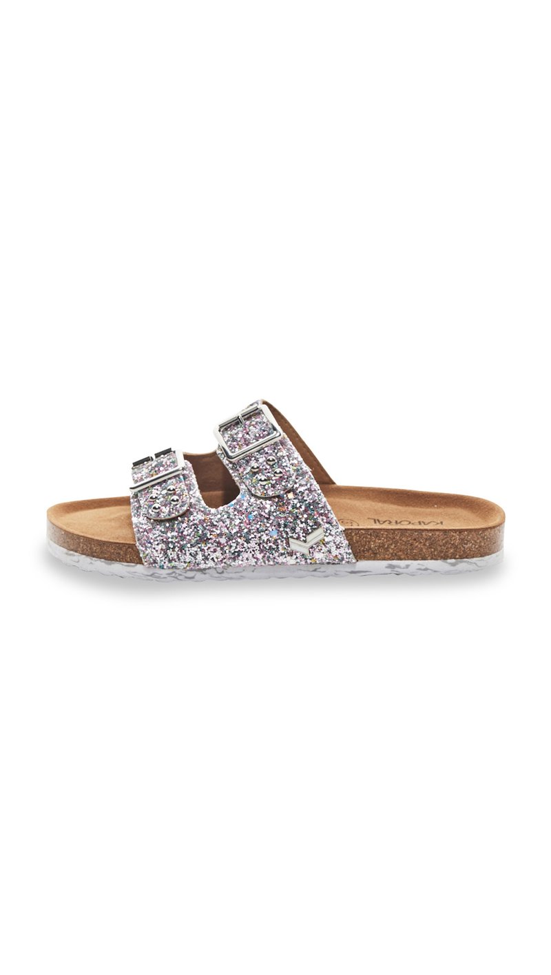 Glittery silver slide sandal with two adjustable buckle straps, contoured cork footbed, and translucent outsole, featuring a flat design.