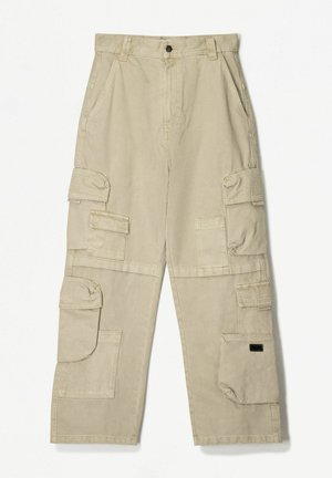 Beige cargo pants made of cotton, featuring multiple pockets, a straight cut, and a button closure at the waistband.