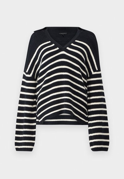 Maglione lavorato a maglia a righe blu navy e bianche con scollo a V, maniche lunghe e dettagli a maglia aperta sulle spalle. Lunghezza cropped con una vestibilità rilassata.