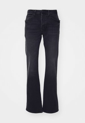 Udsmykkede sorte denimjeans med fem lommer, bæltestropper og en slidteknik. Stof er robust med en glat overflade.
