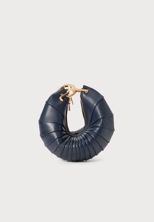 Navy blue leather handbag with a circular pleated design, gold hardware, and a zippered opening. Compact and structured shape, textured surface.