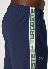 Lacoste Sport TENNIS PANT - Spodnji deli trenirk - navy blue