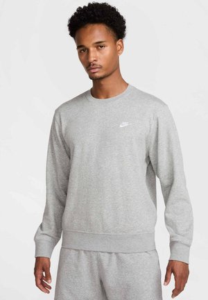 Sweatshirt gris en mélange de coton avec manches longues, col rond et logo Nike sur la poitrine. Présente des poignets et un ourlet côtelés.