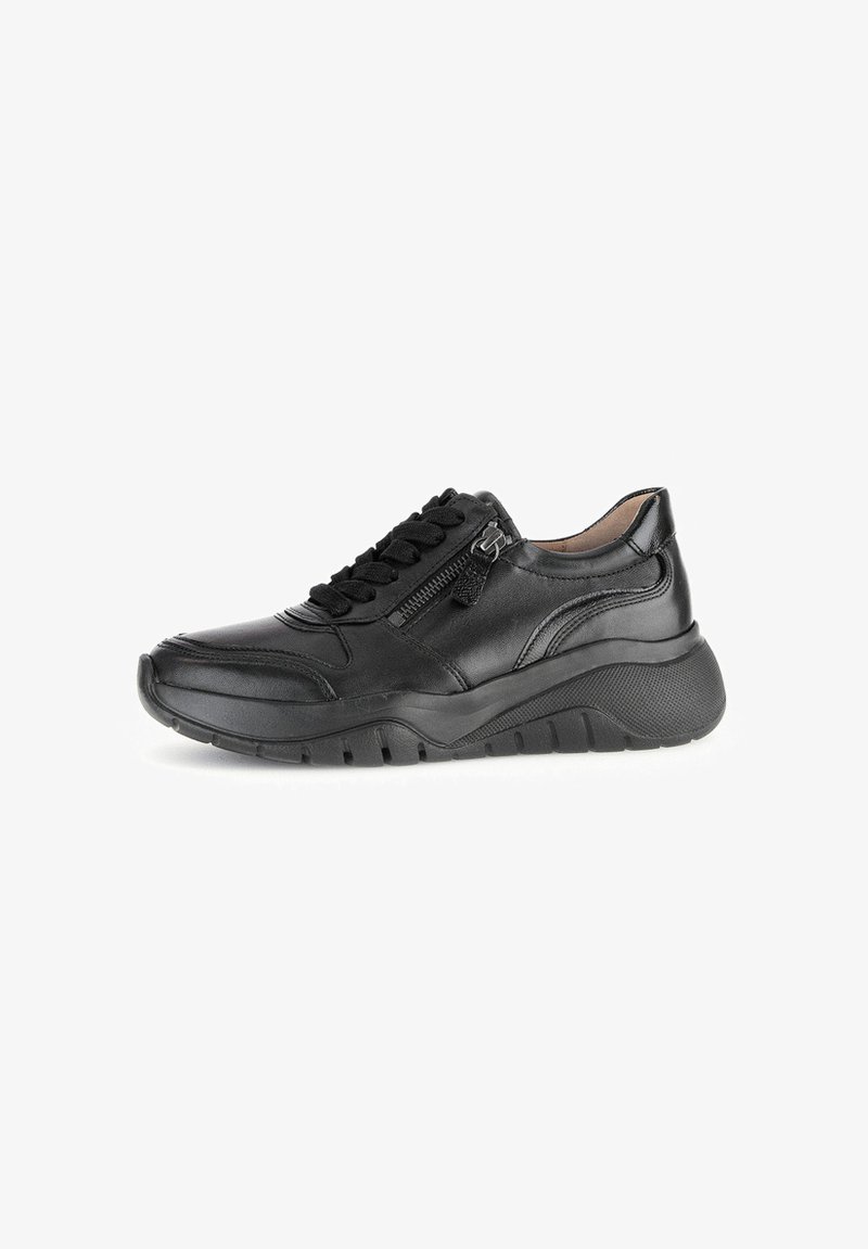 Black leather sneaker with textured surface, lace-up front, and side zipper. Features a thick outsole for added height and grip.