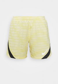 Pantalones cortos deportivos amarillos con un patrón ondulado, cinturilla elástica y un panel lateral negro acentuado con un logo blanco.