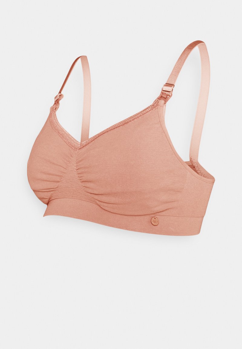 Sostén de color rosa claro con tela suave, diseño fruncido, tirantes ajustables y un pequeño detalle del logo en la banda frontal.