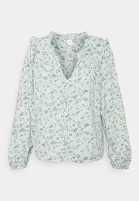 Blusa floreale verde chiaro con scollatura a V, maniche lunghe e chiusura a bottoni; presenta dettagli arricciati sulle spalle e un tessuto morbido e testurizzato.
