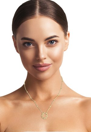 Goldene Halskette mit einem runden Anhänger, der mit Blattan embelliert ist. Die Kette hat gleichmäßig verteilte dekorative Perlen. Glatte, polierte Oberfläche.