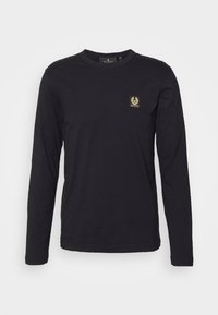Black long-sleeve t-shirt made from cotton. Features a round neckline and a small gold logo patch on the left chest area.