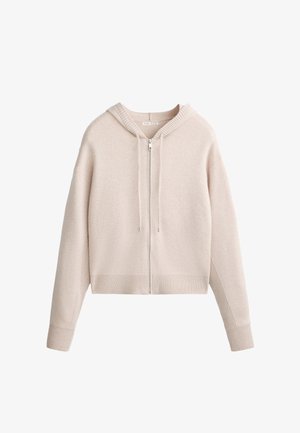 Light beige cropped zip-up hoodie made of soft fabric, featuring a ribbed texture, front pockets, and an adjustable drawstring hood.