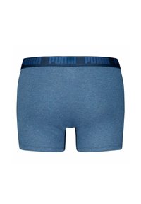 Herrarnas blå bomullsboxershorts med en mörkblå elastisk midjeband som har upphöjd "PUMA"-logotyp och en slät yta.