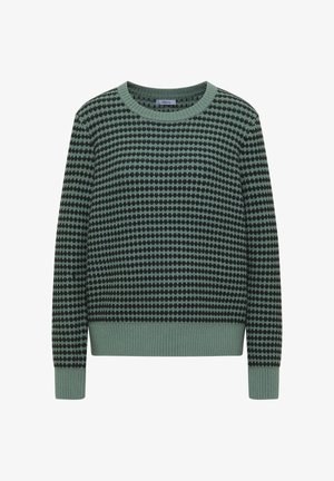 Zelený pletený svetr s vroubkovaným výstřihem a manžetami, zdobený vzorem střídajících se zelených a černých puntíků.