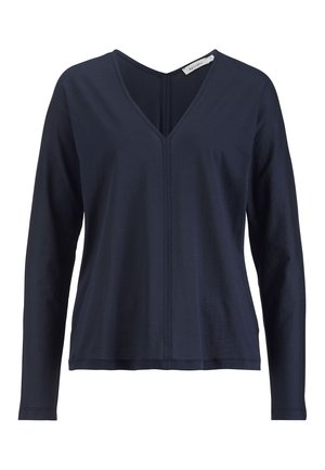 Haut à manches longues bleu marine avec un décolleté en V et des coutures sur le devant, fabriqué à partir d'un tissu doux au toucher lisse.