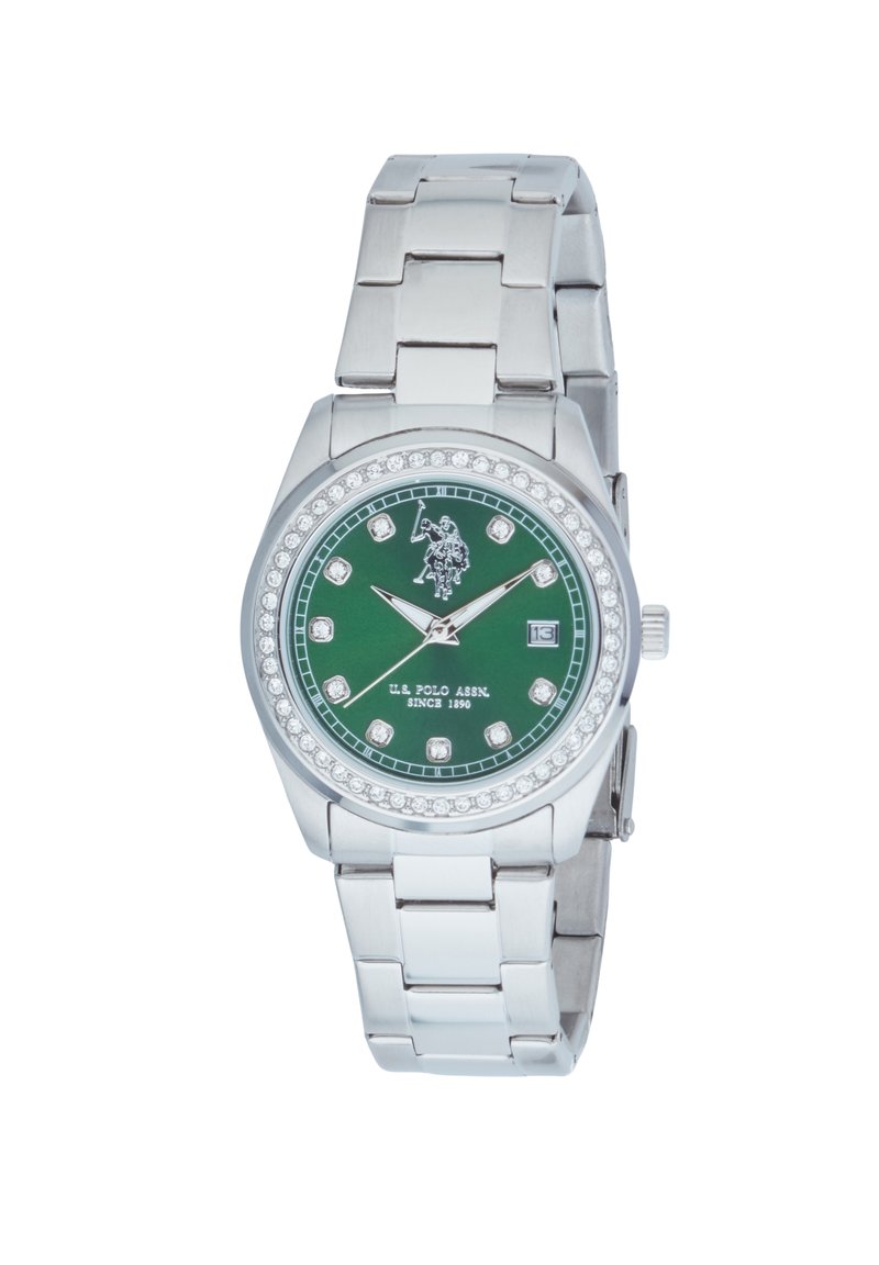 Montre en acier inoxydable argenté avec un cadran rond vert, des accents en cristal et des marqueurs d'heure argentés. Équipée d'un affichage de date à 3 heures.