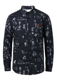 Camisa azul marino con botones que presenta ilustraciones blancas de personajes y texto, con un logo en rojo. Material de algodón, mangas largas, cuello estándar.