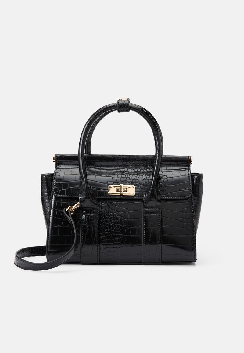 Sac à main noir en cuir synthétique façon crocodile avec double poignée, fermoir doré, poche avant à rabat et bandoulière amovible sur fond blanc.