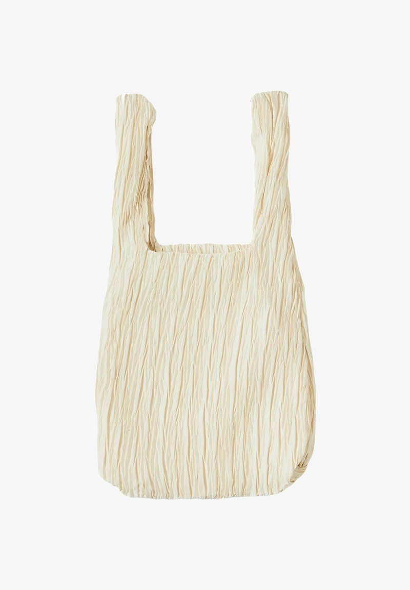 Borsa a spalla tan a forma quadrata, con manici spessi. Realizzata in tessuto morbido con una superficie leggermente strutturata.