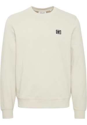 Lys beige sweatshirt med rund hals, ribbede mansjetter og kant. Har et lille sort logo på brystet. Fremstillet af blødt stof.