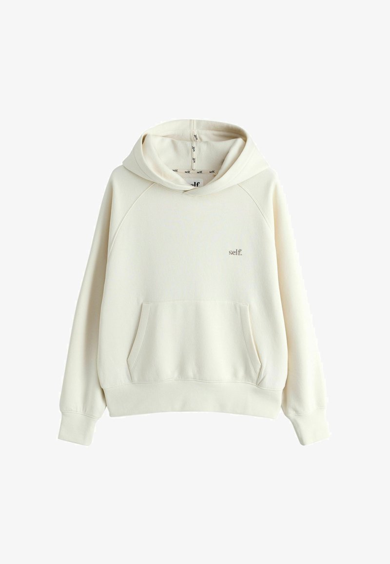 Cremefarbener Hoodie mit Fronttasche und kleinem "self."-Logo auf der linken Brust, präsentiert auf weißem Hintergrund.