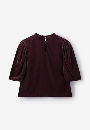 Dunkelburgunderrotes Samtoberteil mit gepufften Ärmeln, rundem Ausschnitt und einem Schlüssellochverschluss am Rücken mit kleinem Knopf.