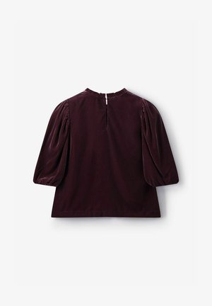Dark burgundy velvet top featuring puffed sleeves, a round neckline, and a keyhole opening at the back with a small button closure.