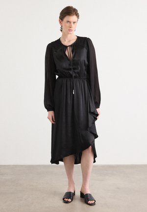 Black satin midi dress with long, puffed sleeves, gathered neckline, drawstring waist, and asymmetrical hemline; smooth texture.