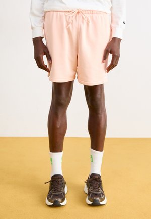 CLUB FLOW  - Tracksuit bottoms - washed coral/white