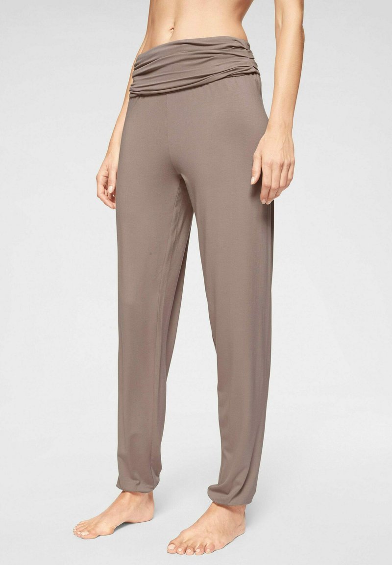 Lichte, taupe-kleurige broeken met een geraffineerde, hoge tailleband. Gemaakt van zachte stof, met een losse pasvorm en taps toelopende benen.