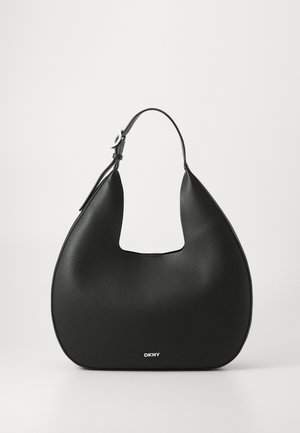 Black leather hobo bag with a single adjustable strap, curved shape, textured surface, and small silver DKNY logo on front center.