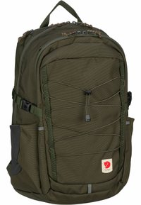 Dark green backpack made of durable fabric, featuring multiple compartments, front bungee cord, and side mesh pockets. Leather brand logo.