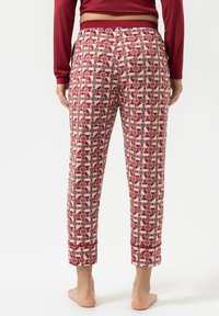 Geprinte pyjamabroek met een patroon van rode, grijze en witte cirkels, voorzien van een elastische tailleband en verkorte pijpen.