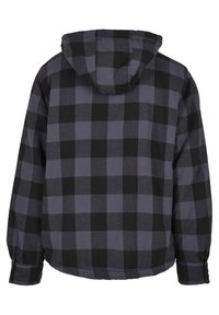 Huoodad flanelljacka i svart och grå rutig mönster. Mjuk bomullsmaterial med avslappnad passform och elastiska manschetter för komfort.