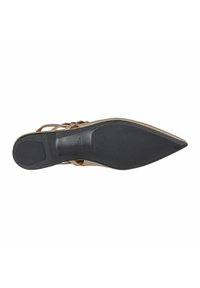 Brown leather shoe with a pointed toe, featuring a black rubber sole and multiple strap accents. The sole is smooth with a textured heel.