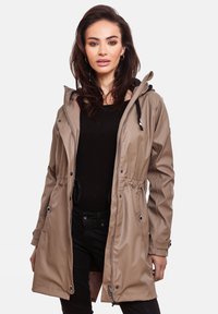 Beige waterproof jacket with a cinched waist, zip closure, and drawstring hood. Features silver hardware and a smooth, glossy texture.