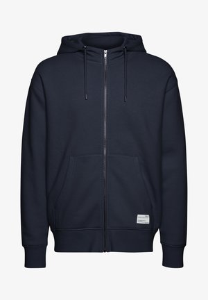 Haut de hoodie zippé bleu marine en tissu doux, avec une capuche dotée de cordons de serrage, des poches avant, des poignets côtelés et un petit écusson logo.
