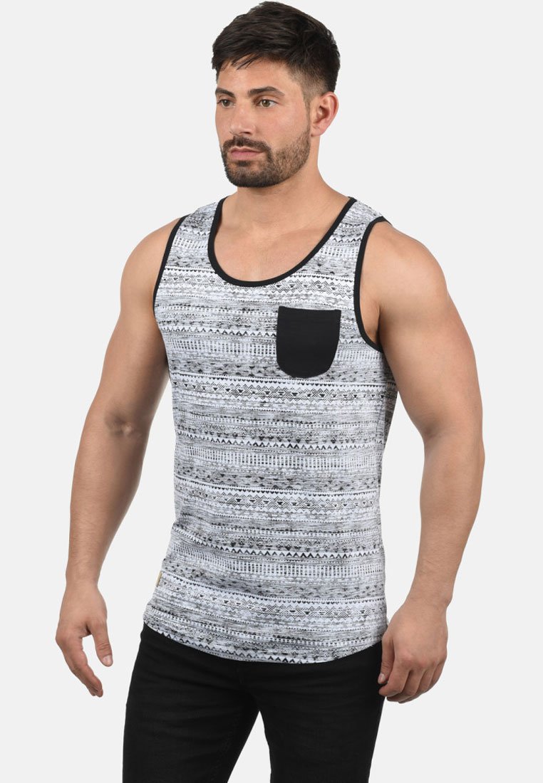 Black and white patterned tank top with a black pocket; made of lightweight material; features a round neck and sleeveless design.