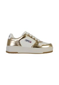 White and gold sneaker with a smooth, shiny metallic finish, lace-up design, padded tongue, and textured rubber sole. Classic athletic style.