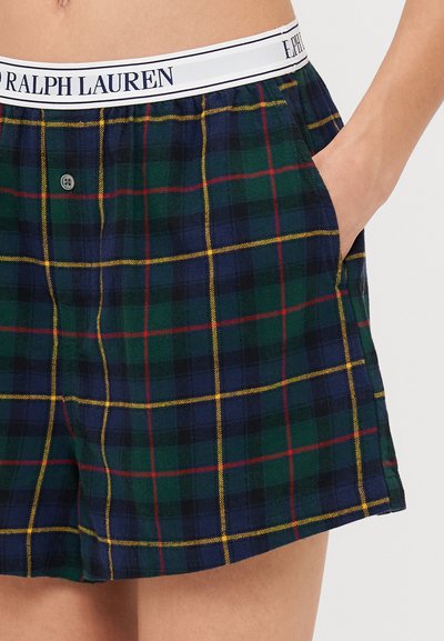 Apsirenkamos džinsinio audinio šortai su žalia, tamsiai mėlyna ir raudona spalvomis, balta juosta su užrašu "Ralph Lauren". Turime šonines kišenes.