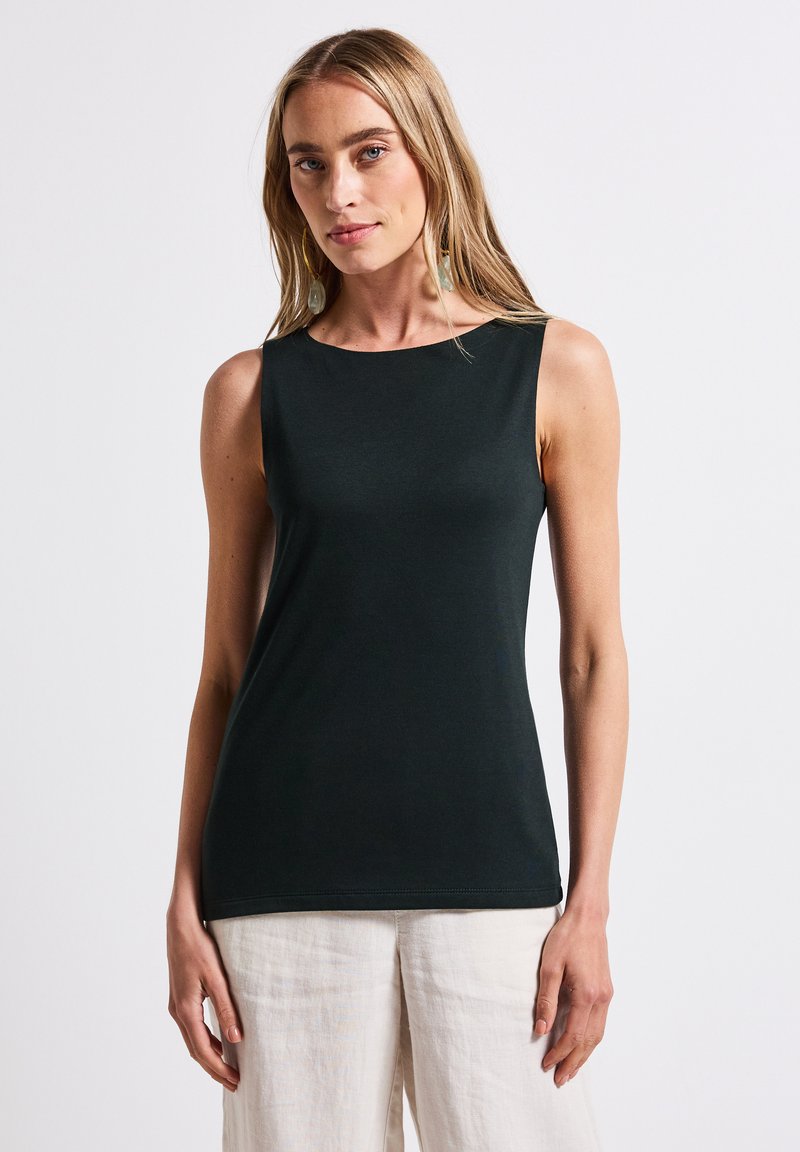 Top tumma vihreä ilman hihoja, jossa on pyöreä kaula-aukko ja joka on valmistettu sileästä materiaalista. Helma on suora ja istuvuus on tiukka.