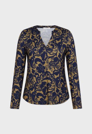 Maglietta a maniche lunghe con scollo a V caratterizzata da un motivo floreale navy su sfondo beige. Tessuto morbido con vestibilità rilassata e orlo arrotondato.