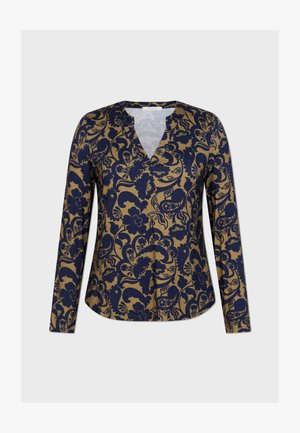 Top de manga larga con cuello en V que presenta un patrón floral en azul marino sobre un fondo beige. Tejido suave con un corte relajado y dobladillo redondeado.