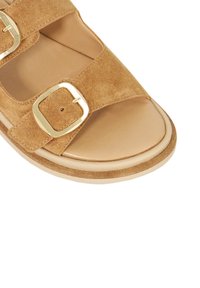 Brown suede sandal with two wide straps, gold-tone buckles, rounded toe, and a cushioned footbed, featuring a light rubber sole.