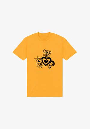 T-shirt jaune à manches courtes présentant un graphisme noir de trois personnages de dessin animé avec une forme de cœur au centre.
