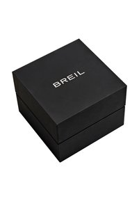 Boîte rectangulaire noire à finition mate, avec le nom de la marque "BREIL" en relief argenté sur la surface supérieure.