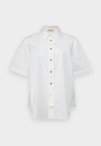 Camicia bianca a maniche corte in cotone, con colletto e chiusura frontale con bottoni dorati. Fessure laterali all'orlo.