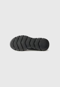 Black shoe sole with a textured, zig-zag pattern. Made from rubber, featuring a smooth, rounded toe and defined tread for grip.