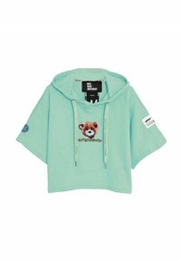 Sudadera corta color verde menta con un gran gráfico de un oso, capucha, mangas cortas y cordones. Presenta un parche de marca en la manga.
