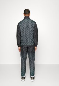 Sergio Tacchini FORESTA  - Träningsset - black/ocean wave