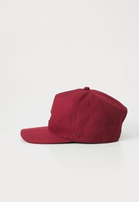 Maroon cap with a flat brim and embroidered logo in front. Features a round top button and side stitching for size adjustment.