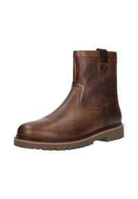Bruine leren enkelboots met een gestructureerde afwerking, ronde neus en contrasterende rubberen zool. Voorzien van een trekband voor eenvoudig aan- en uittrekken.